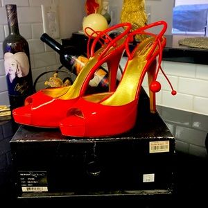 Red patent leather size 10 report signature pumps gently used